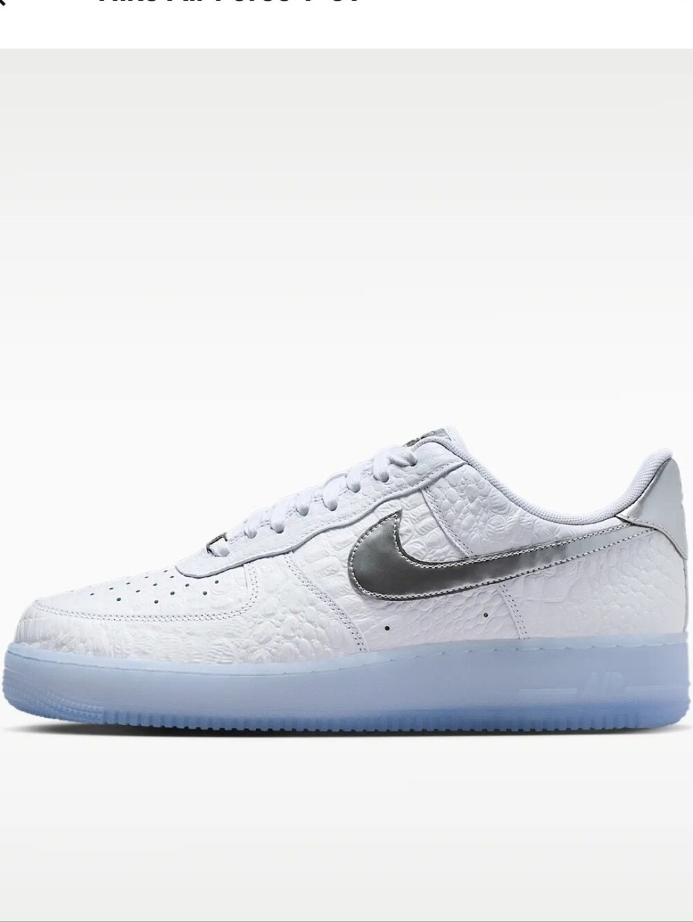Nike White Low-Top Sneakers with Silver Swoosh